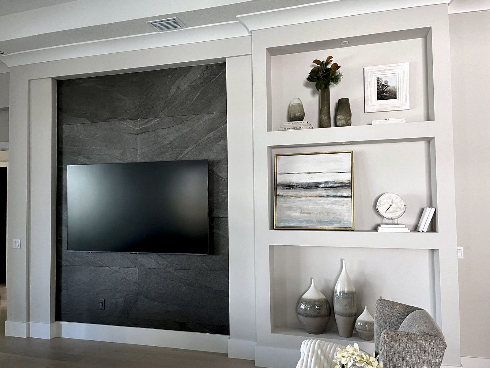 Built-in media wall with lit shelving niches
