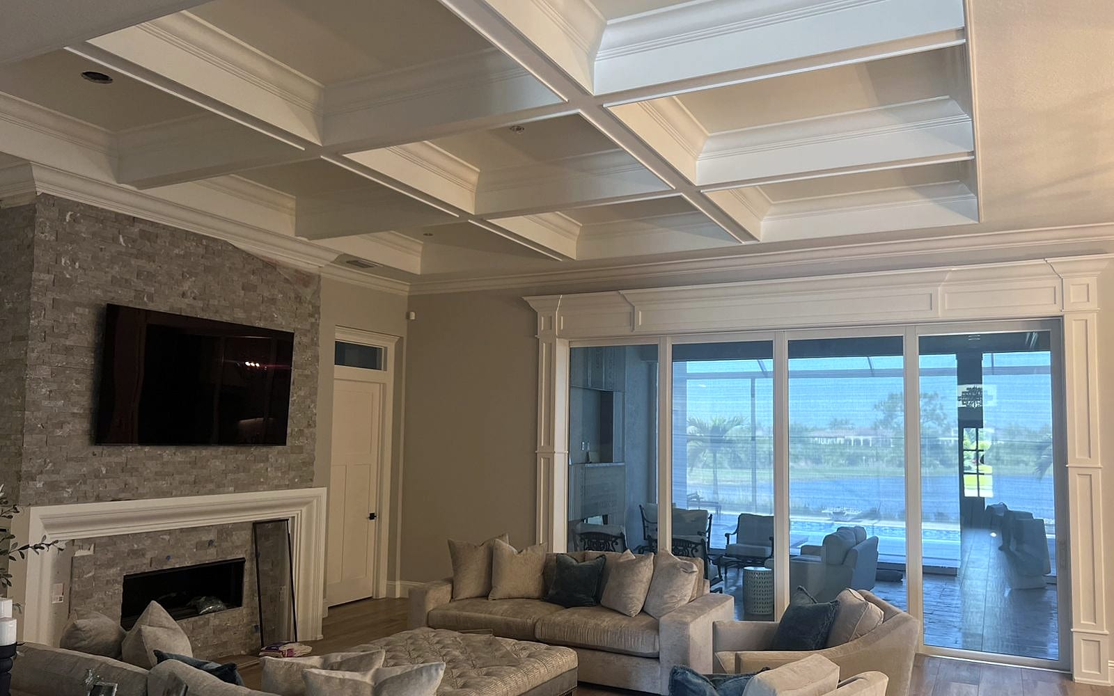 Coffered ceiling with crown molding in a Southwest Florida living room